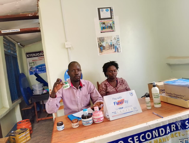 Staff of Tembo products display some of their products at Kyenjojo Secondary School in Kyenjojo. 